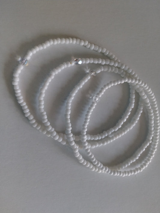 White bead anklets.